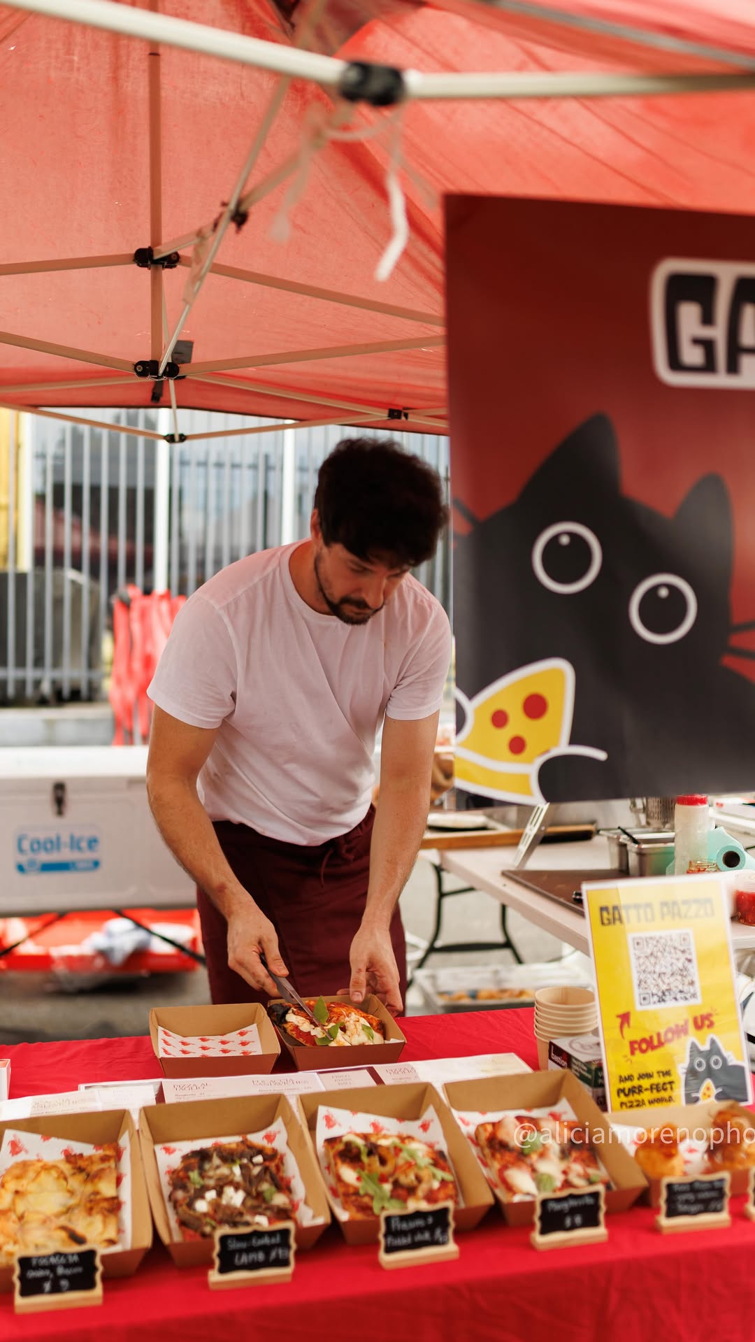 Chef Marco Sfamurri preparing food at the Gatto Pazzo market stall