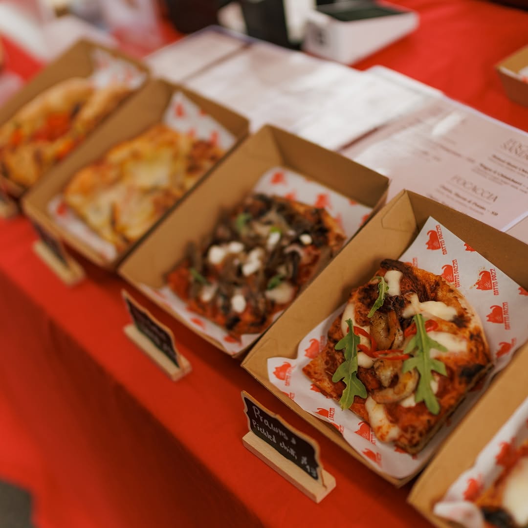 Roman pizza slices served in branded boxes at the market